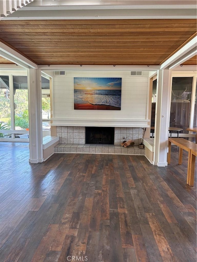 2727 Pine Creek Cir, Fullerton, CA 92835 - unfurnished living room featuring wood ceiling, dark wood-type flooring, and a tile fireplace