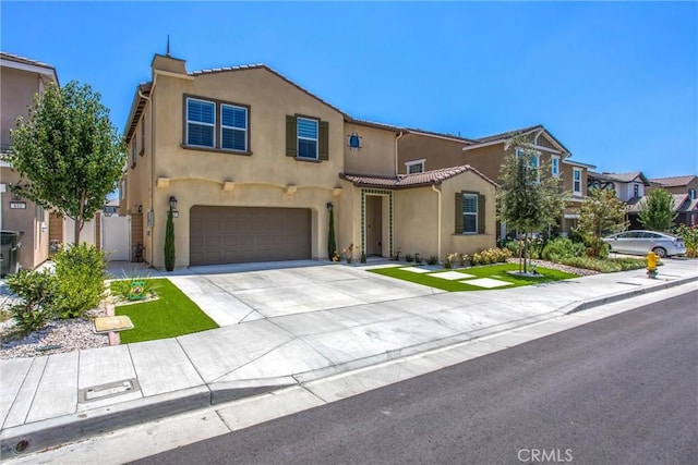 849 Half Moon Ave, Redlands, CA 92374 - view of front facade featuring stucco siding, an attached garage, concrete driveway, and a tiled roof