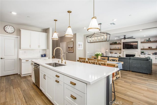 849 Half Moon Ave, Redlands, CA 92374 - kitchen with light wood-style flooring, dishwasher, light countertops, decorative backsplash, and recessed lighting