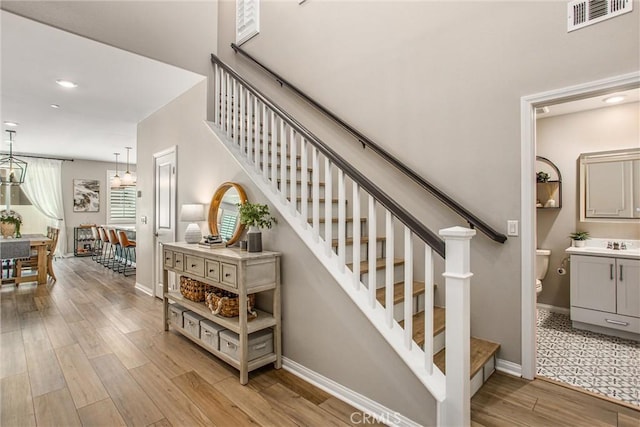 849 Half Moon Ave, Redlands, CA 92374 - stairs featuring wood finished floors and recessed lighting