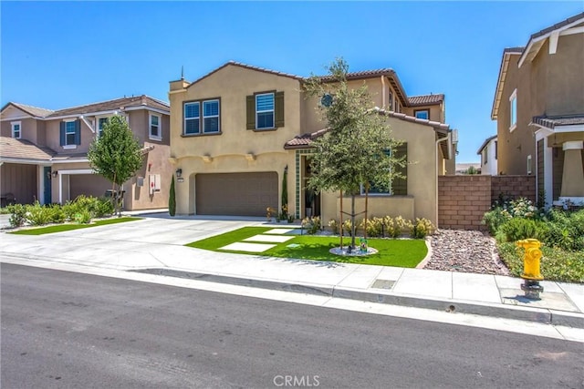 849 Half Moon Ave, Redlands, CA 92374 - mediterranean / spanish home featuring stucco siding, an attached garage, concrete driveway, and a tiled roof