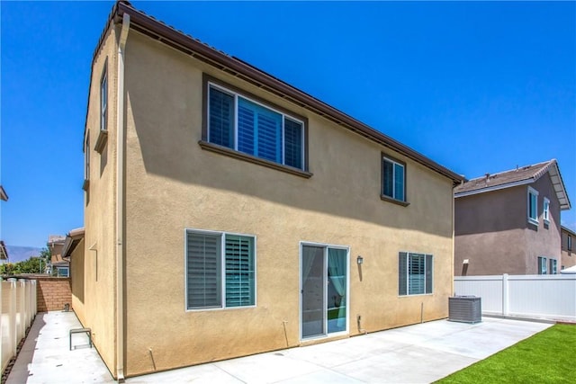 849 Half Moon Ave, Redlands, CA 92374 - back of property with a patio area, a fenced backyard, and stucco siding