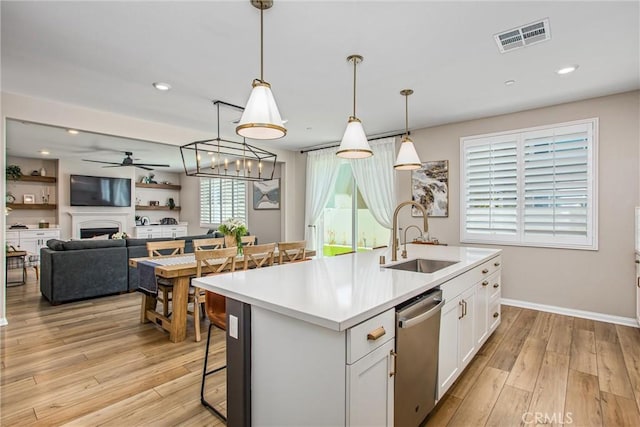 849 Half Moon Ave, Redlands, CA 92374 - kitchen featuring dishwasher, white cabinetry, light wood-style flooring, a ceiling fan, and recessed lighting