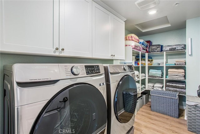 849 Half Moon Ave, Redlands, CA 92374 - laundry room with independent washer and dryer, attic access, cabinet space, and wood finished floors