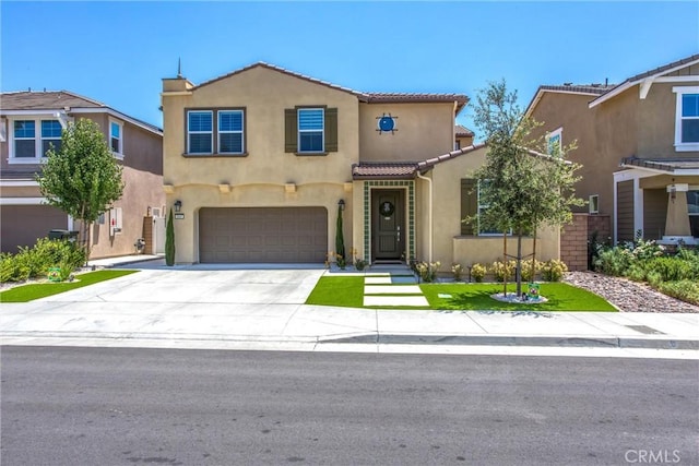 849 Half Moon Ave, Redlands, CA 92374 - view of front facade featuring stucco siding, an attached garage, a tile roof, and concrete driveway