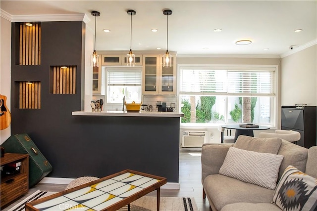 972 Larrabee St Unit 119, West Hollywood, CA 90069 - living room with crown molding, a wall mounted AC, wood finished floors, and recessed lighting