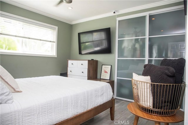 972 Larrabee St Unit 119, West Hollywood, CA 90069 - bedroom with wood finished floors, crown molding, and recessed lighting
