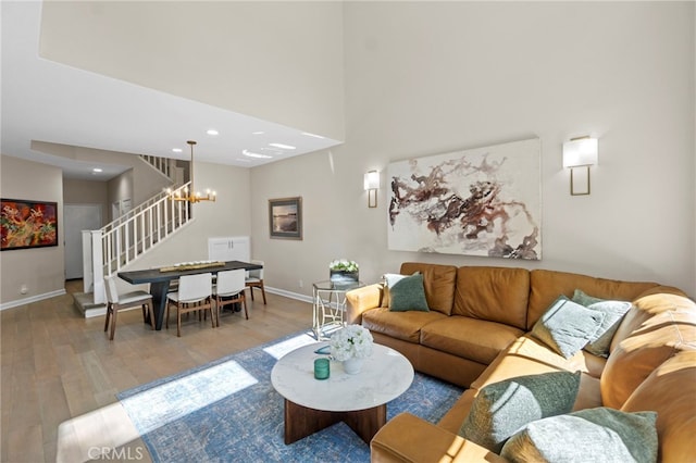 22 Brassie Ln, Coto De Caza, CA 92679 - living area with stairs, wood finished floors, a chandelier, a towering ceiling, and recessed lighting