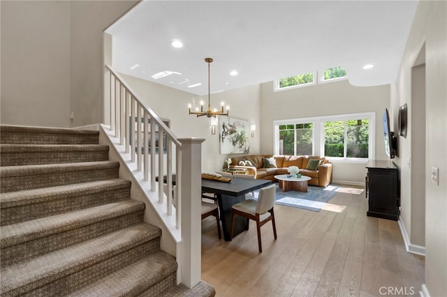22 Brassie Ln, Coto De Caza, CA 92679 - stairs with hardwood / wood-style flooring, recessed lighting, and a chandelier