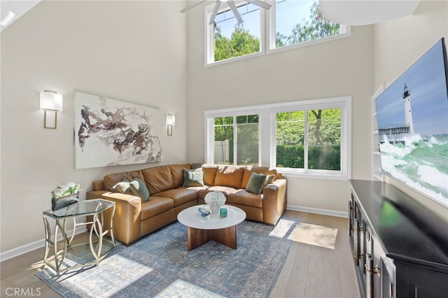 22 Brassie Ln, Coto De Caza, CA 92679 - living room with wood finished floors, plenty of natural light, and a towering ceiling