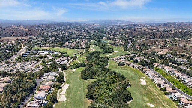 22 Brassie Ln, Coto De Caza, CA 92679 - aerial overview of property's location with a mountain backdrop, a golf club, and nearby suburban area