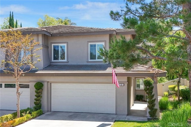22 Brassie Ln, Coto De Caza, CA 92679 - view of front of property featuring a garage, concrete driveway, and stucco siding