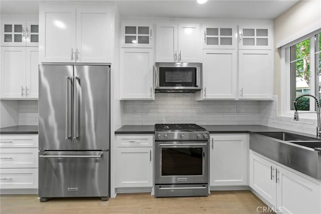 22 Brassie Ln, Coto De Caza, CA 92679 - kitchen featuring stainless steel appliances, dark countertops, and white cabinets