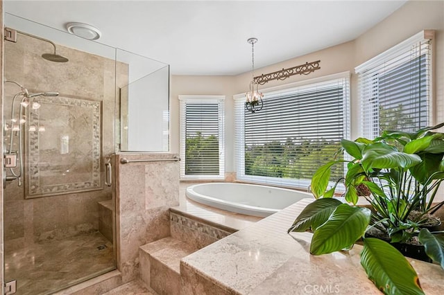 25291 Derbyhill Dr, Laguna Hills, CA 92653 - bathroom with a shower stall, a garden tub, and a chandelier