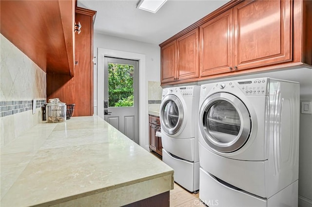 25291 Derbyhill Dr, Laguna Hills, CA 92653 - washroom with washing machine and clothes dryer and cabinet space