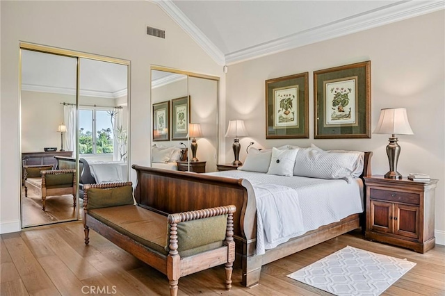 25291 Derbyhill Dr, Laguna Hills, CA 92653 - bedroom with two closets, vaulted ceiling, ornamental molding, and wood finished floors
