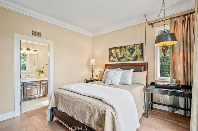 25291 Derbyhill Dr, Laguna Hills, CA 92653 - bedroom featuring light wood-style floors, crown molding, multiple windows, and connected bathroom