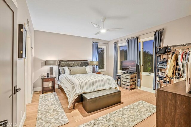 25291 Derbyhill Dr, Laguna Hills, CA 92653 - bedroom featuring light wood-style floors and ceiling fan