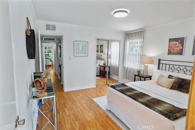 5525 Costello Ave, Sherman Oaks, CA 91401 - bedroom featuring crown molding, a closet, and light wood-style floors