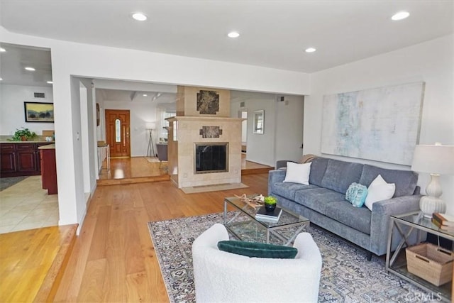 5525 Costello Ave, Sherman Oaks, CA 91401 - living room with light wood-style flooring, recessed lighting, and a premium fireplace