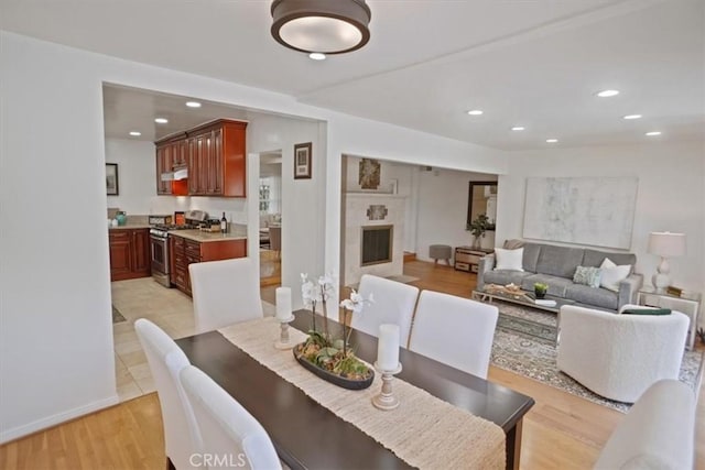 5525 Costello Ave, Sherman Oaks, CA 91401 - dining room featuring recessed lighting, a fireplace, and light wood finished floors
