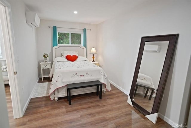 5525 Costello Ave, Sherman Oaks, CA 91401 - bedroom featuring an AC wall unit, a wall unit AC, wood finished floors, and recessed lighting