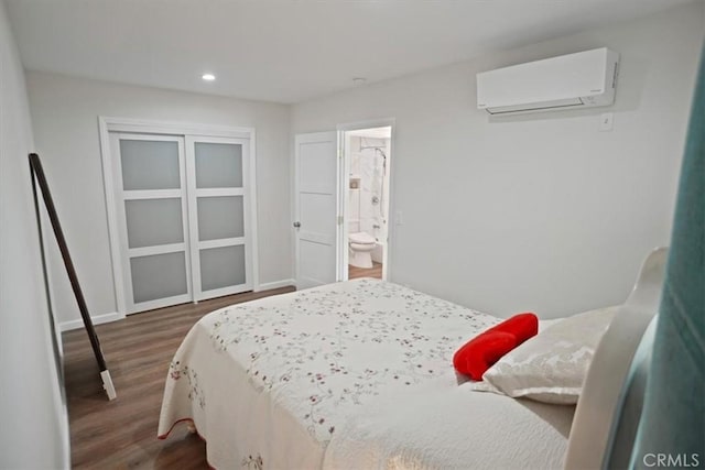 5525 Costello Ave, Sherman Oaks, CA 91401 - bedroom featuring an AC wall unit, dark wood-style floors, recessed lighting, and connected bathroom
