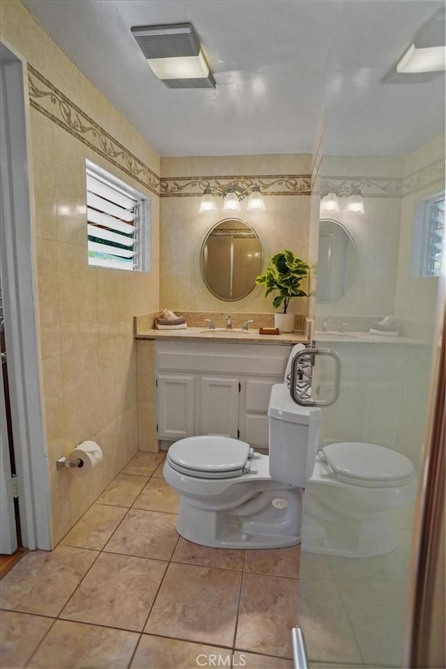 5525 Costello Ave, Sherman Oaks, CA 91401 - bathroom featuring vanity, tile walls, and tile patterned floors