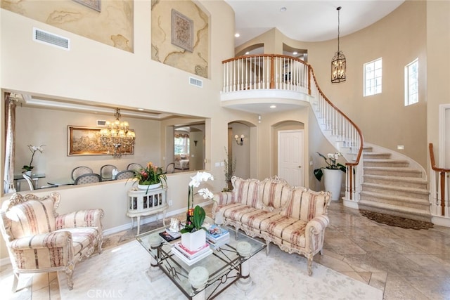 2 Shadow, Irvine, CA 92620 - living area with a chandelier, stairs, a high ceiling, plenty of natural light, and arched walkways