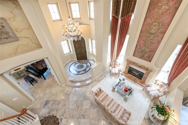 2 Shadow, Irvine, CA 92620 - foyer with a fireplace, a chandelier, plenty of natural light, and a towering ceiling