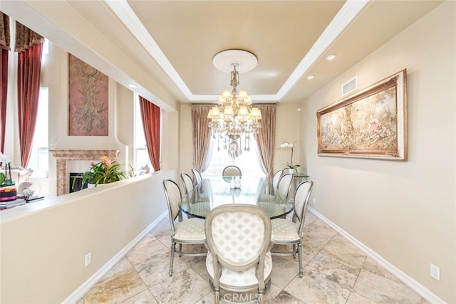 2 Shadow, Irvine, CA 92620 - dining area with healthy amount of natural light, a chandelier, a raised ceiling, and a fireplace