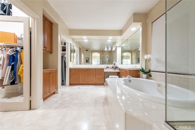 2 Shadow, Irvine, CA 92620 - bathroom with vanity, a garden tub, a walk in closet, marble finish floors, and recessed lighting