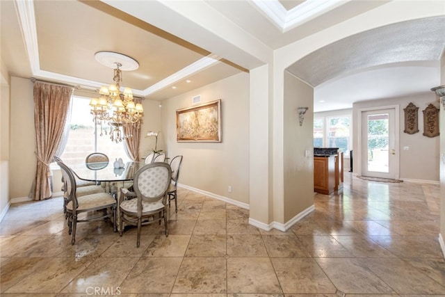 2 Shadow, Irvine, CA 92620 - dining area with arched walkways, a raised ceiling, and a chandelier