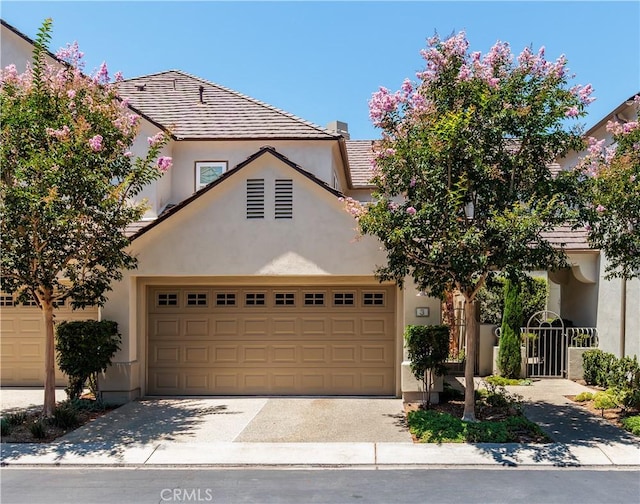 3 Longbourn Aisle, Irvine, CA 92603 - view of front of property featuring stucco siding, an attached garage, and driveway