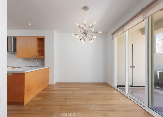 3 Longbourn Aisle, Irvine, CA 92603 - unfurnished dining area with a chandelier, light wood-style floors, and recessed lighting