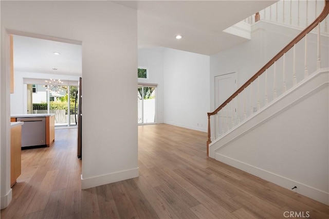 3 Longbourn Aisle, Irvine, CA 92603 - hall featuring stairs, light wood-type flooring, a chandelier, and recessed lighting