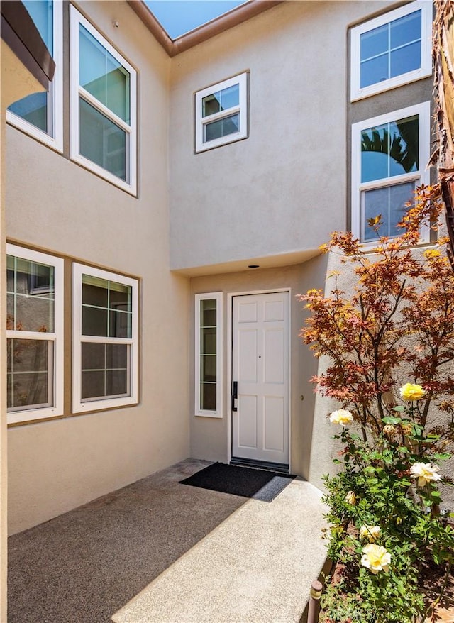 3 Longbourn Aisle, Irvine, CA 92603 - property entrance with stucco siding and a patio