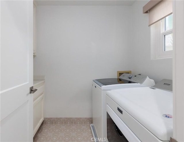 3 Longbourn Aisle, Irvine, CA 92603 - washroom featuring separate washer and dryer, cabinet space, and light tile patterned flooring