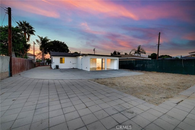 3310 Mangum St, Baldwin Park, CA 91706 - view of front facade with a patio area, a fenced backyard, and driveway
