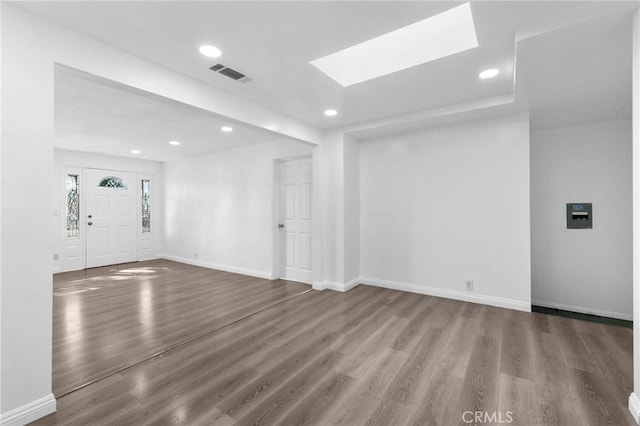 3310 Mangum St, Baldwin Park, CA 91706 - unfurnished living room with wood finished floors, recessed lighting, and a skylight
