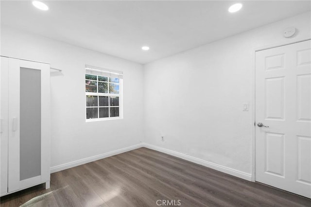 3310 Mangum St, Baldwin Park, CA 91706 - unfurnished bedroom featuring dark wood-style floors and recessed lighting