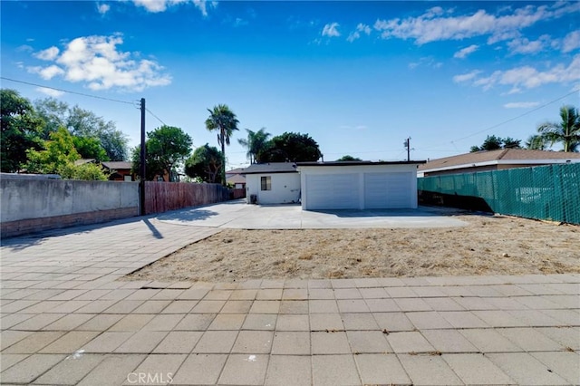 3310 Mangum St, Baldwin Park, CA 91706 - view of front of house with a patio and a garage