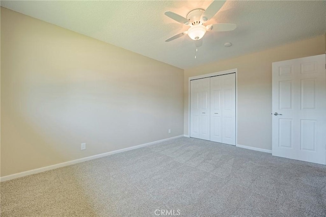 2601 Hoover Ct, Merced, CA 95340 - unfurnished bedroom with carpet flooring, a textured ceiling, a closet, and ceiling fan