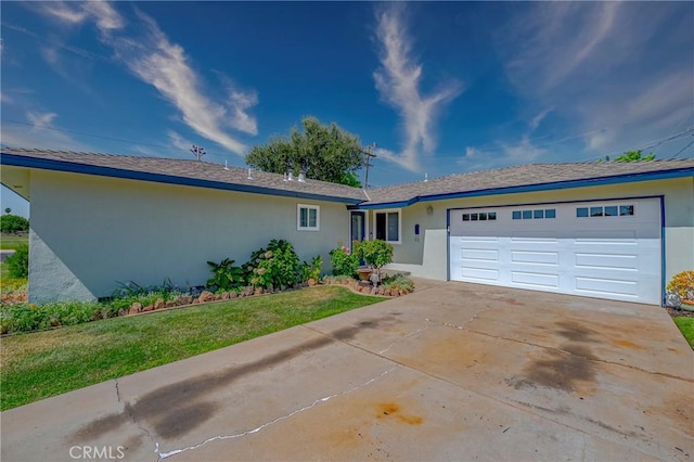 2601 Hoover Ct, Merced, CA 95340 - ranch-style house with an attached garage, stucco siding, driveway, and a front lawn