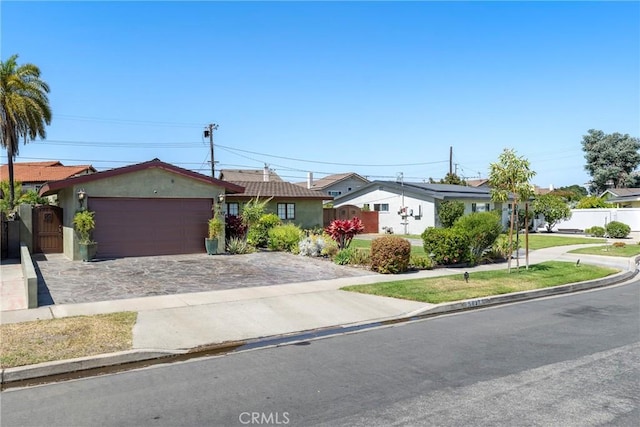 5837 Los Arcos Way, Buena Park, CA 90620 - ranch-style house featuring an attached garage, driveway, and stucco siding