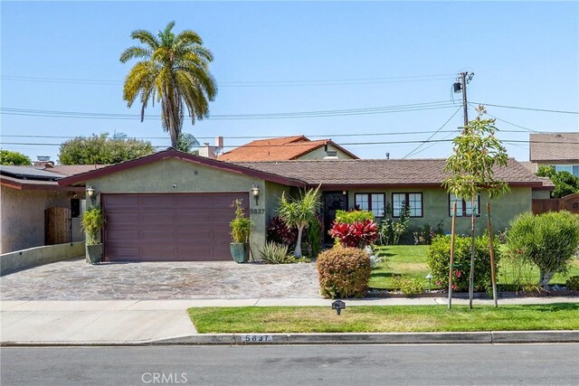 5837 Los Arcos Way, Buena Park, CA 90620 - single story home with a garage, driveway, and stucco siding
