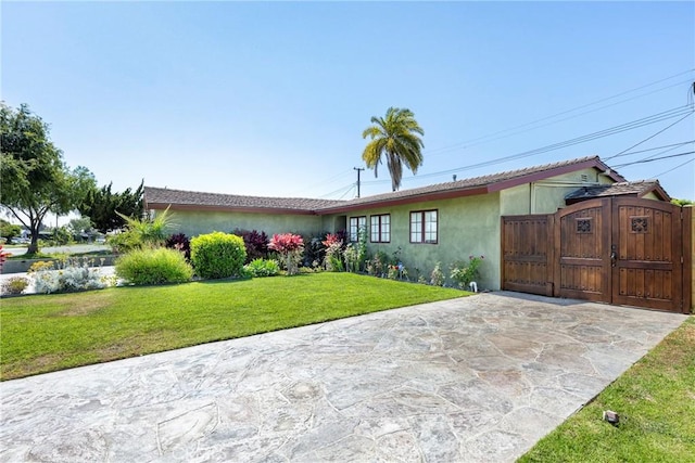 5837 Los Arcos Way, Buena Park, CA 90620 - ranch-style house with stucco siding, a gate, and a front yard