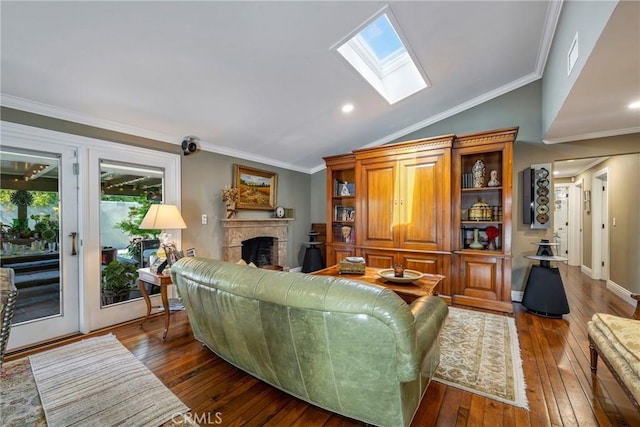 5837 Los Arcos Way, Buena Park, CA 90620 - living area featuring a skylight, vaulted ceiling, wood-type flooring, crown molding, and a fireplace