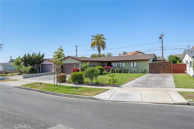 5837 Los Arcos Way, Buena Park, CA 90620 - ranch-style house with concrete driveway, a gate, stucco siding, and a garage