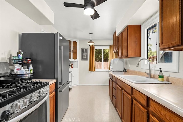 886 Lynn Ln, Chico, CA 95926 - kitchen with stainless steel gas range, ceiling fan, and light countertops